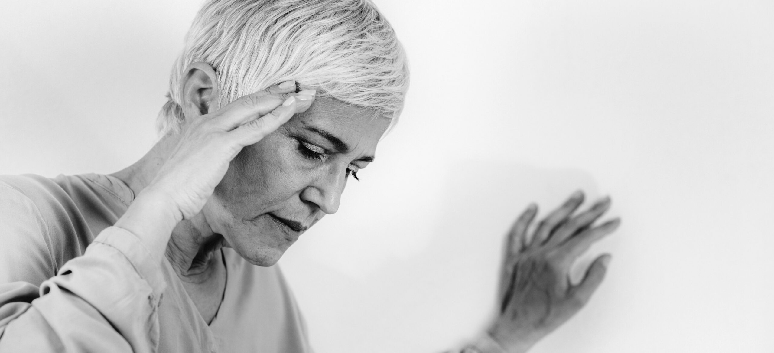 A woman feeling dizzy needing Vestibular Physiotherapy